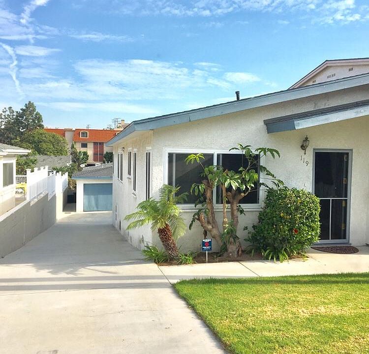 Driveway leading to detached two car garage