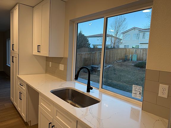 Large kitchen sink, quartz counters, new backsplash, new paint, new flooring. New appliances will be installed shortly.
