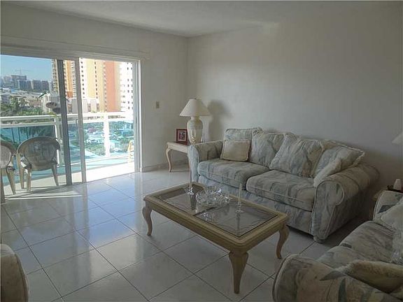 PANORAMIC WATER VIEWS FROM THIS 2BED/2BATH CORNER UNIT STEPS FROM THE BEACH