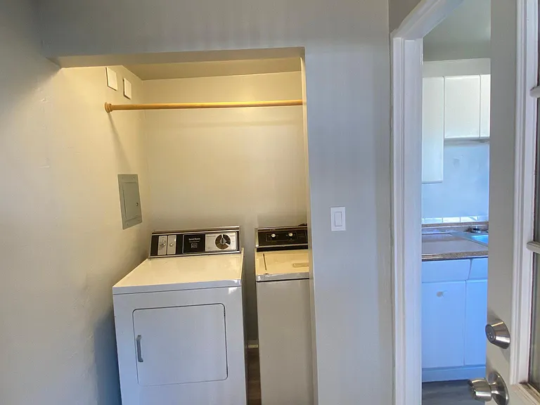 Laundry room with full sized washer and dryer in unit!