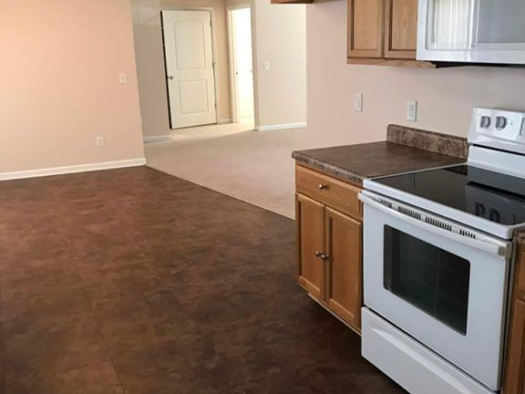 Kitchen (yes there is a refrigerator there now!) looking toward the living room and 2nd bedroom