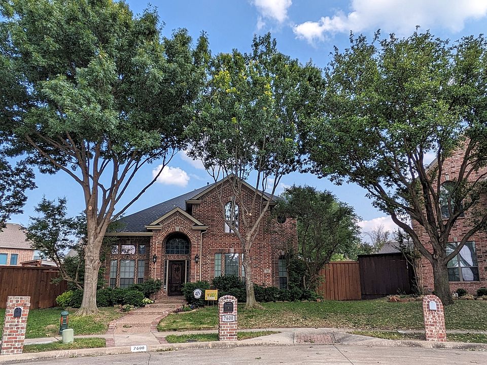 Front yard entrance with mature trees