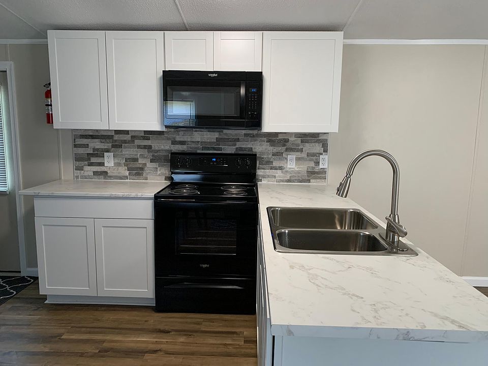 Kitchen with 3D stone stacked backsplash