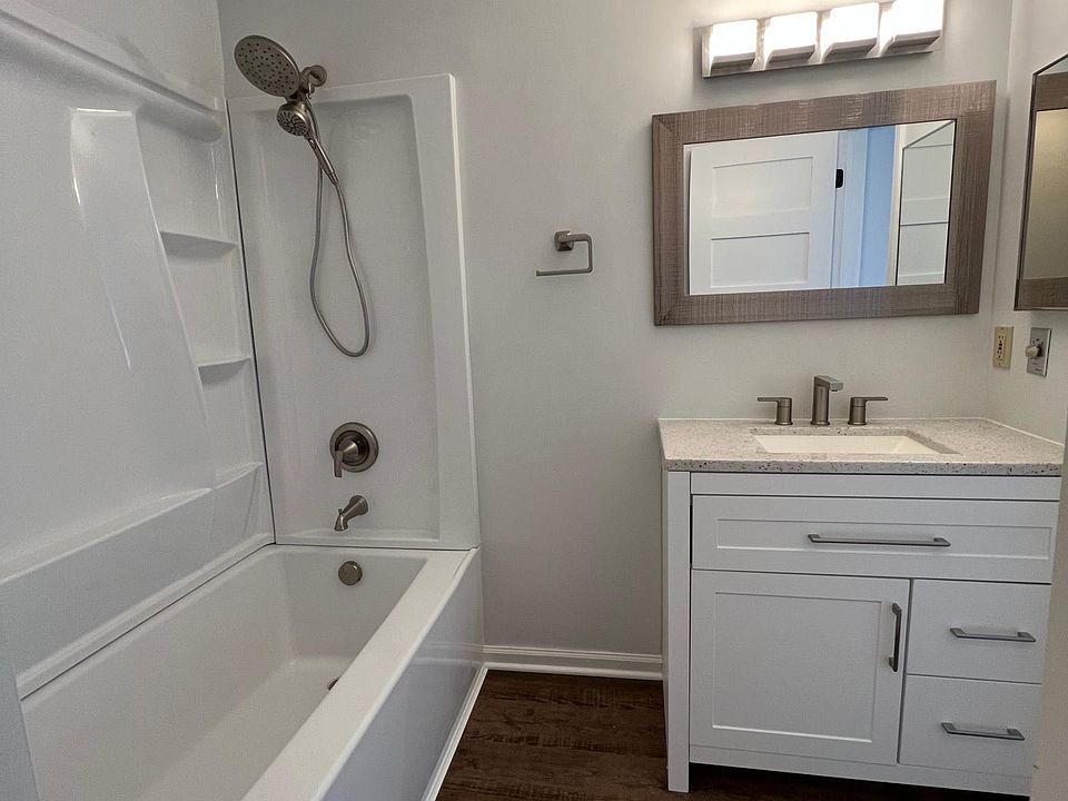 Master bath was just fully remodeled! It features Luxury Vinyl tile floor, a new vanity, a new shower/tub combo, new faucets, new mirror, new fixtures and new lighting.