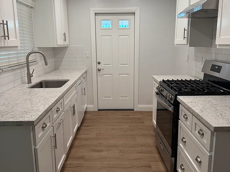 Kitchen with door to patio area.