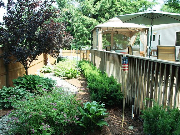 Backyard with path to Hot Tub
