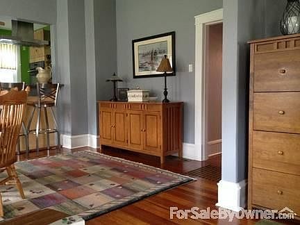 Original character, modern amenities
						:
						Open floor plan with original wood floors, 10 inch baseboards and 9'3" ceilings.