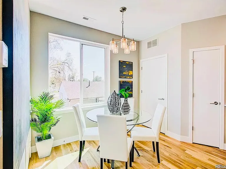 Enjoy meals in this airy dining area, styled with elegance and natural light. Enjoy meals in this airy dining area, styled with elegance and natural light.