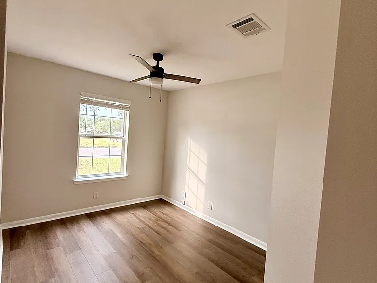 Third bedroom (front of house) - view from entry