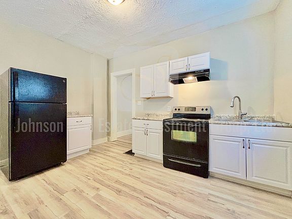 Updated kitchen with new cabinets, flooring and fixtures.