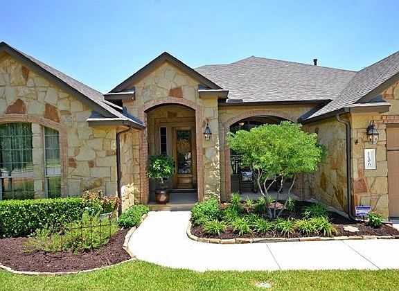 Greet your guests from this lovely landscaped entry.