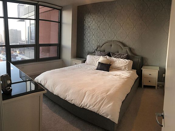 Bedroom fits King Bed comfortably. With his and her custom closets. Gorgeous views of rapidly developing South Loop.