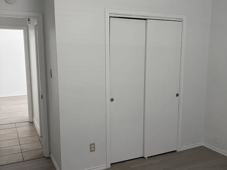 Secondary bedroom #1 closet and entry hallway