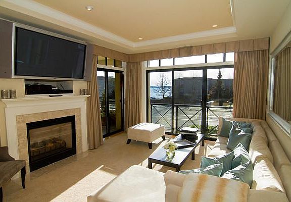 Living room with gas fireplace and view of Lake Washington