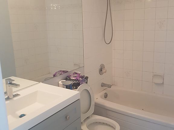 Elegant bathroom with a glass shower door and a high-end shower head.