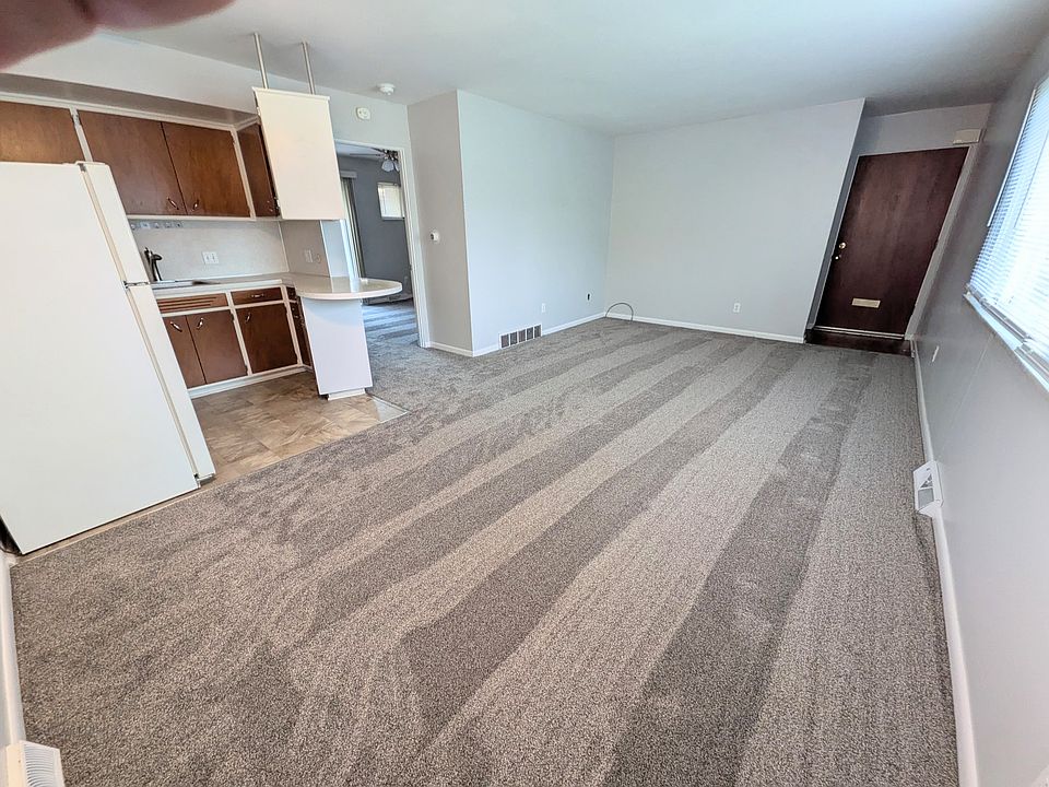 Kitchen and living room. New carpet and paint