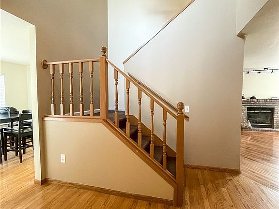 Beautiful hardwood floors lead you into the home. Vaulted ceiling make for a bright and cheery entry 