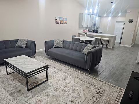 Open living concept with living room, dining room, and kitchen.