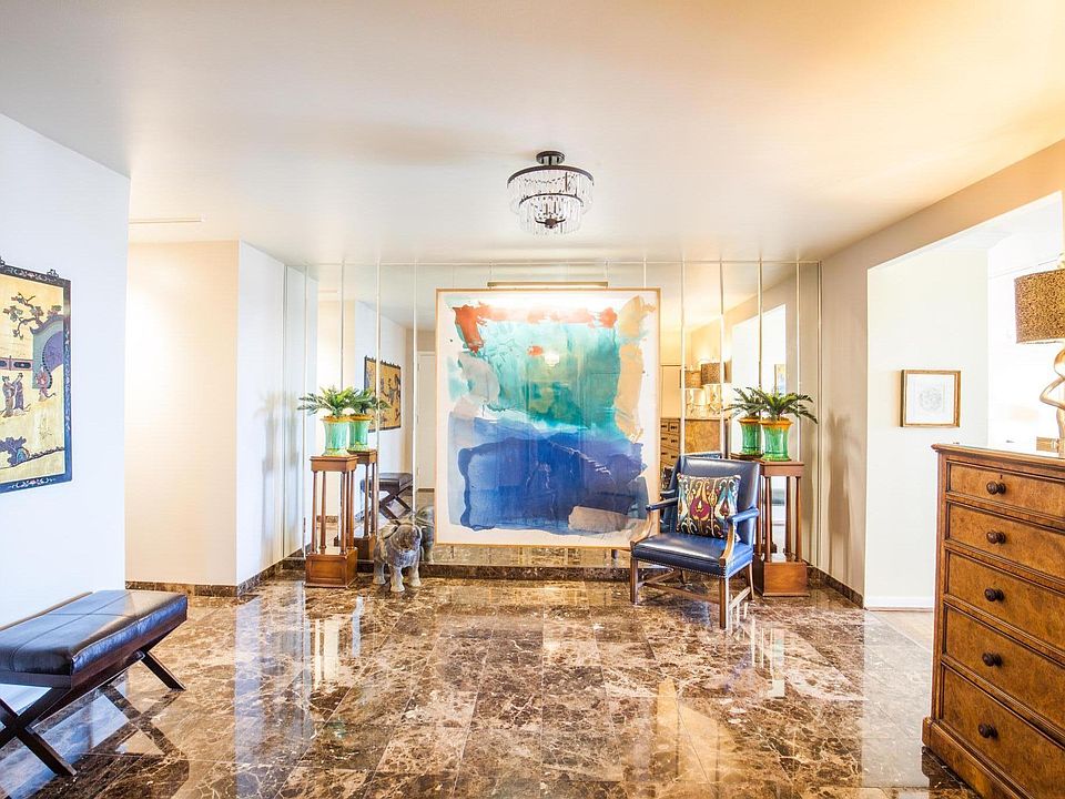 Eleven ten greets you with a spacious foyer with marble floo