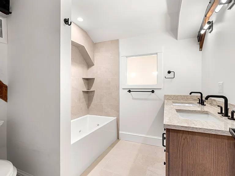 Guest, on-suite Bath with Jacuzzi! Look out to downtown.