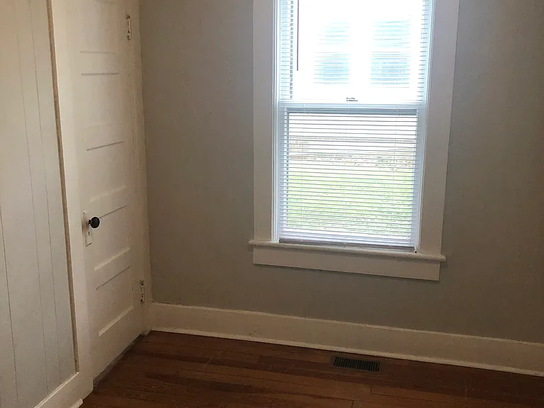 Rear of second bedroom with closet door