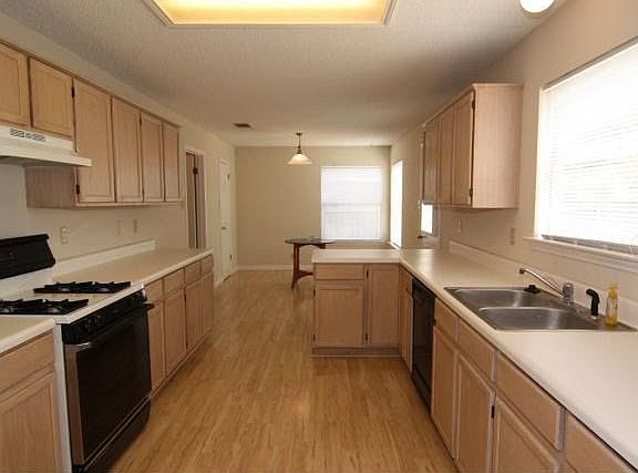 spacious kitchen with Pergo laminate flooring