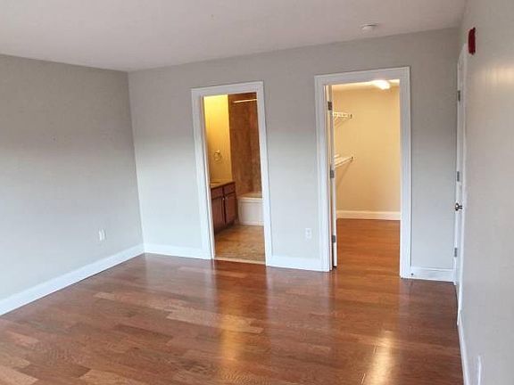 Owner's suite bedroom and walk-in closet