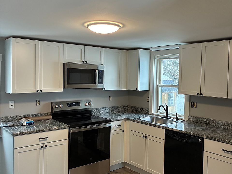 Brand new kitchen cabinets with granite countertops and new LVP floor