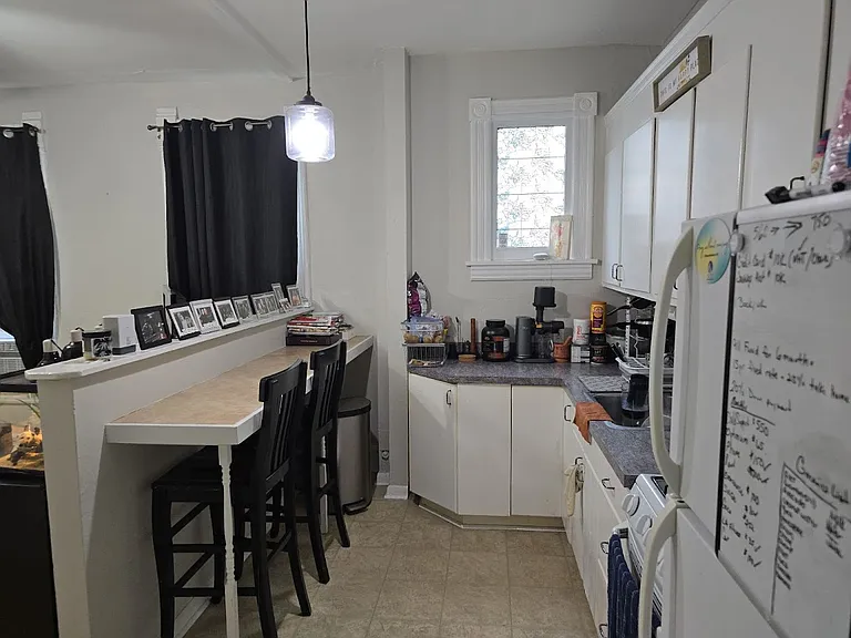 View of kitchen/living room area from hallway.