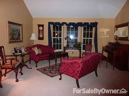 Vaulted ceiling living room
						:
						The living room opens to the lovely dining room for formal entertaining.