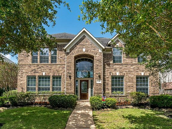 A rare 6 bedroom or 5 with a media room floorplan that backs to other homes.