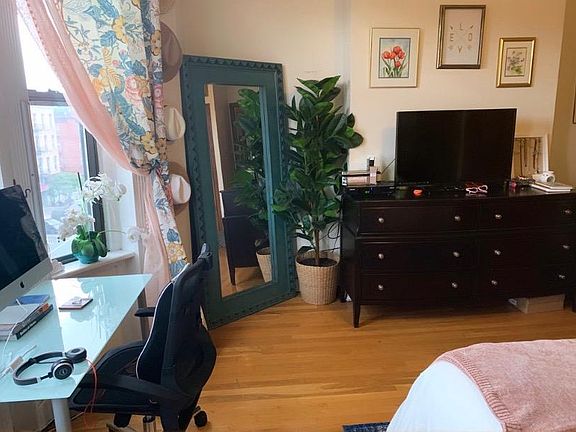 Large front bedroom with bay window and view