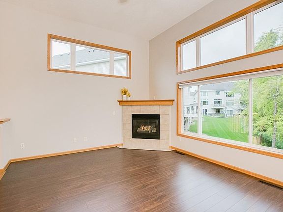 The main level living room with gas fireplace and huge windows allowing for tons of natural light. T