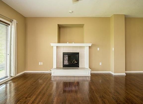 This cozy fireplace enhances the family room.