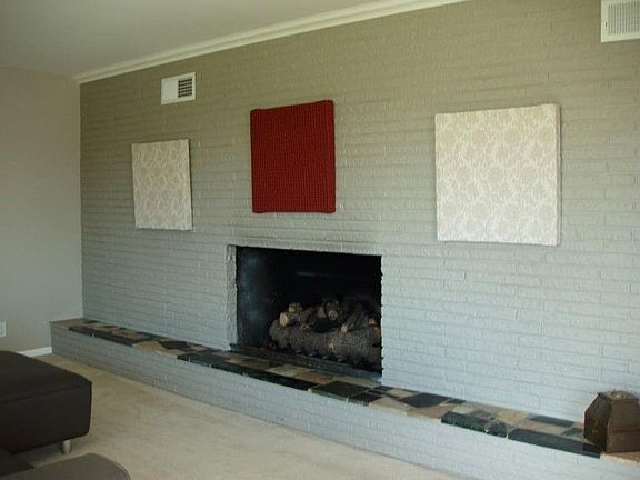 Living room with floor to ceiling windows make this room bright and inviting