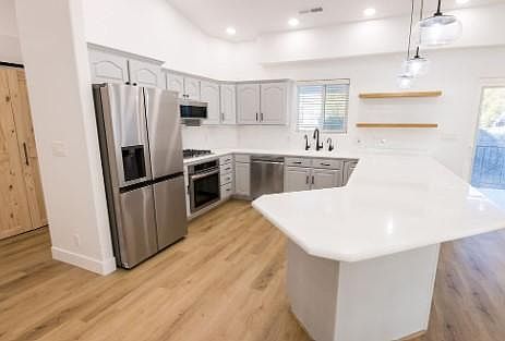 Kitchen view features open shelving, all new upgraded appliances