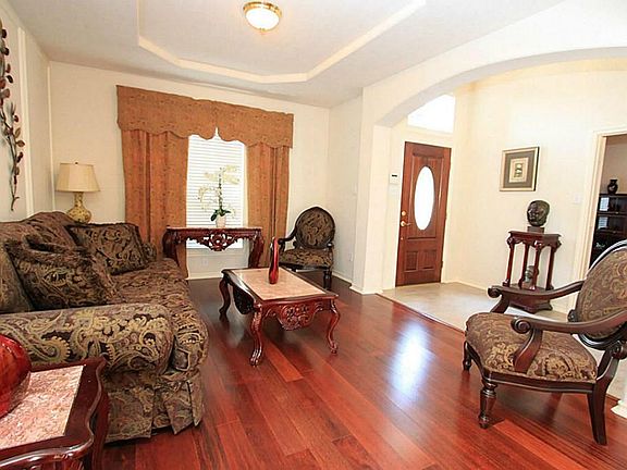 The formal living room greets you upon entrance.