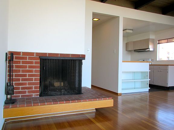 2nd angle of fireplace & kitchen