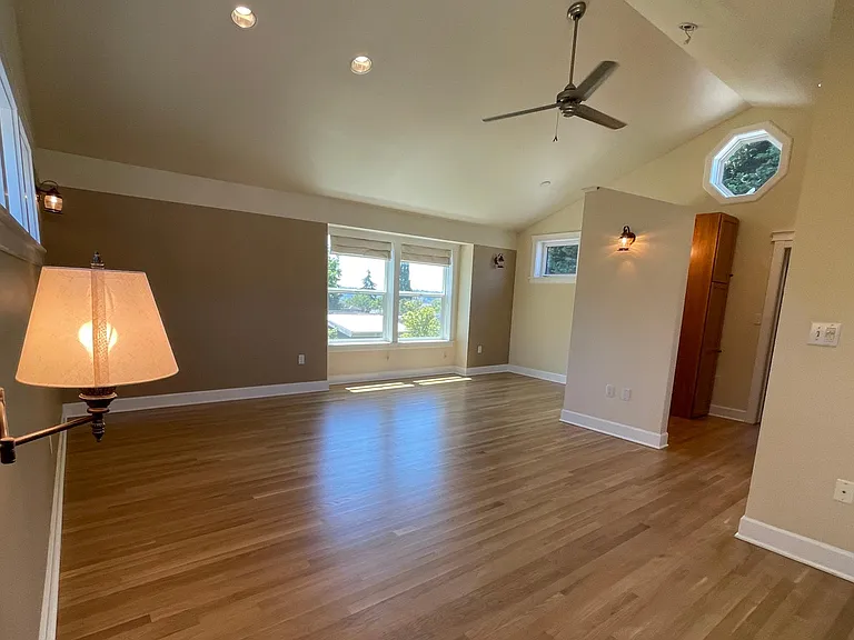 Primary suite is the entire top floor sitting high above the neighbors with views of downtown, Magnolia, Queen Anne, and peek-a-boo mountain views. Bring your Peloton or sitting area and relax in your private sanctuary!