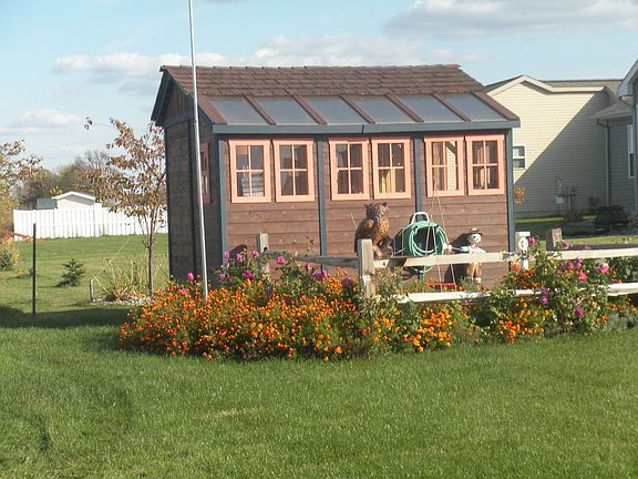 greenhouse shed and herb garden