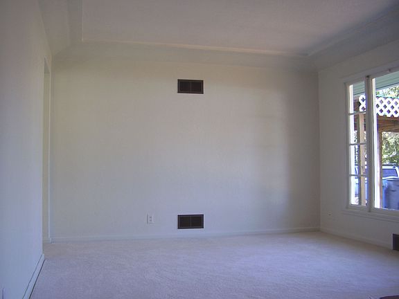 Living Room with Coved Ceiling, New Carpet with Hardwood Underneath
