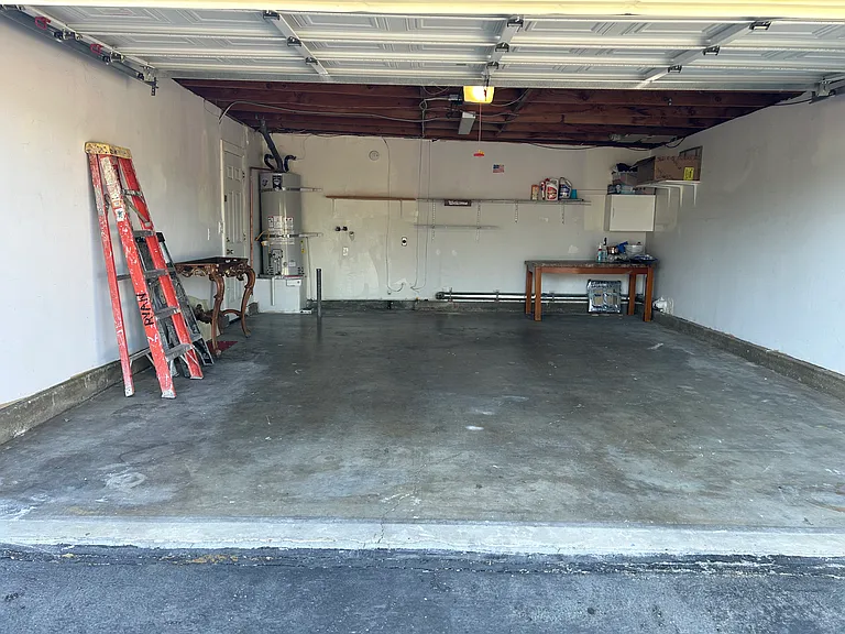2 CAR GARAGE WITH WASHER/DRYER HOOKUPS.SHELVES ABOVE WASHER/DRYER