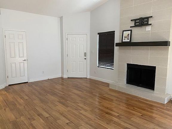 Living room w/front entry & fireplace