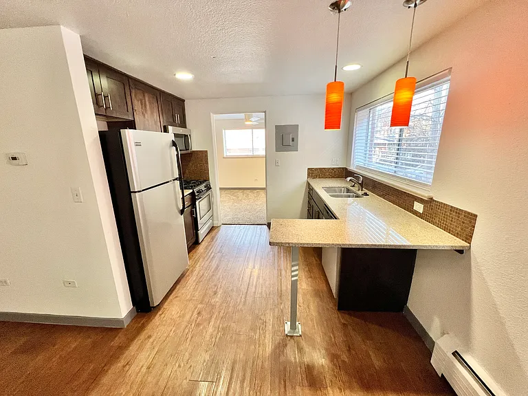 Explore this chic kitchen space, featuring sleek fixtures and an inviting atmosphere. Explore this chic kitchen space, featuring sleek fixtures and an inviting atmosphere.