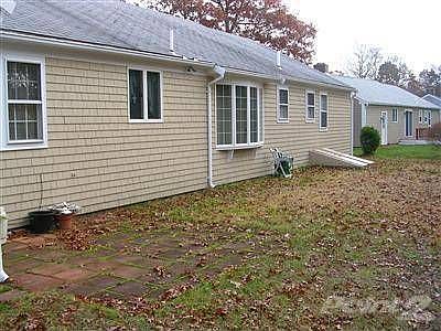 Back of house with patio