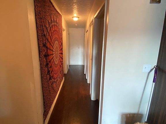 hallway leading to bathroom on right - then master on right Left are two bedrooms #2, #3