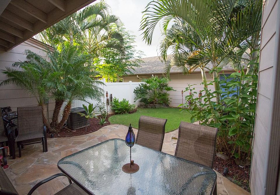 Backyard leading to garage