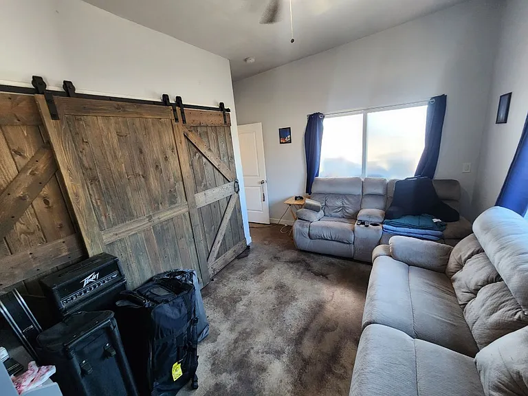 first bedroom on north side has two large windows and a sliding door. Th closet is nearly wall to wall .