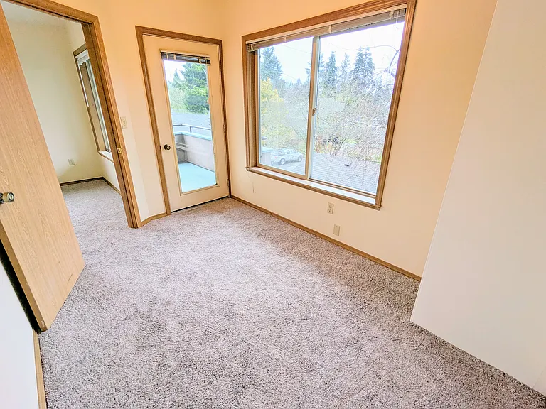 209 2nd bedroom or office with large window and balcony access
