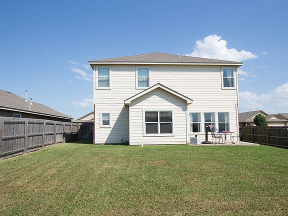 Back view of home and patio